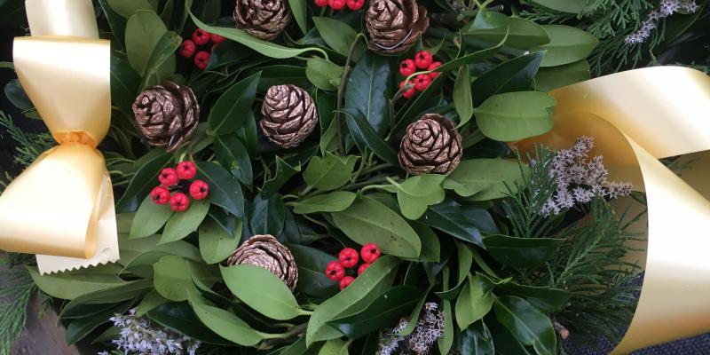 fresh holly wreath berries cones pink sprigs gold ribbon