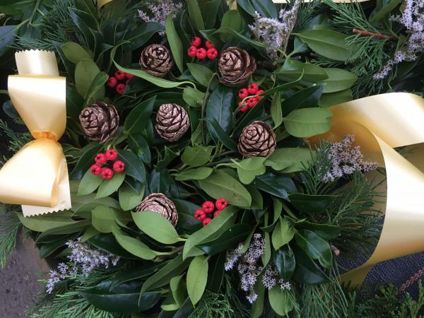 fresh holly wreath berries cones pink sprigs gold ribbon