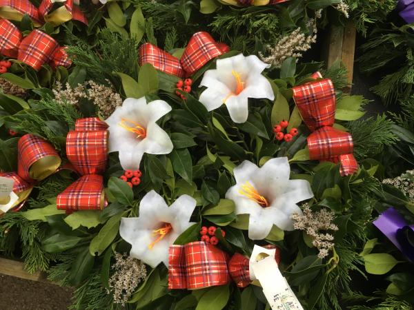 fresh holly wreath lilies tartan ribbon