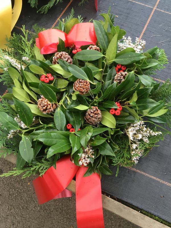fresh holly wreath berries cones white sprigs red ribbon