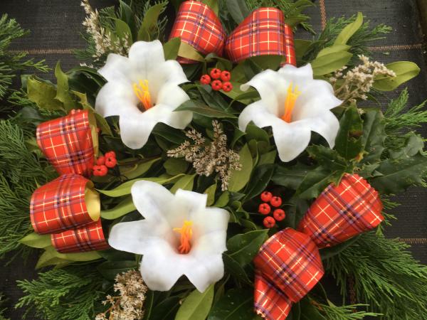 fresh holly wreath berries white sprigs white lilies tartan ribbon