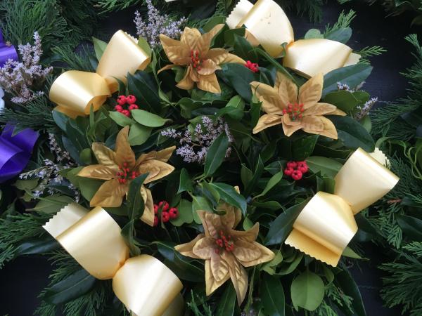 fresh holly wreath gold poinsettia berries lilac sprigs gold ribbon